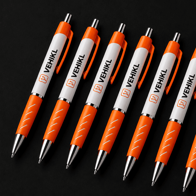 Orange and white Vehikl pens